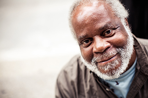 African american man with white beard smiling at the camera